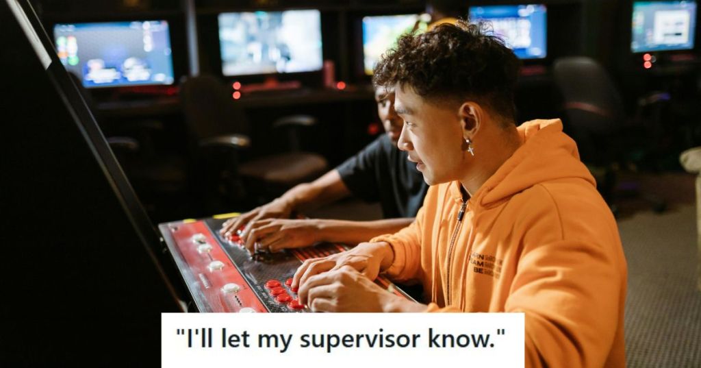 Man in orange hoodie playing games