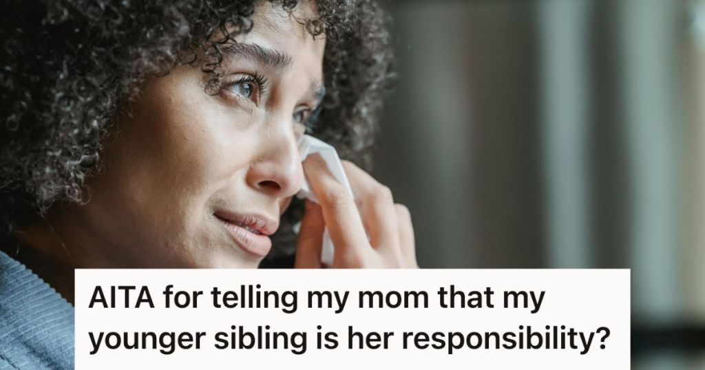 Crying woman wiping her tears