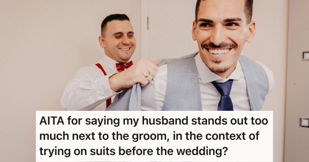 Man helping another man put on a suit