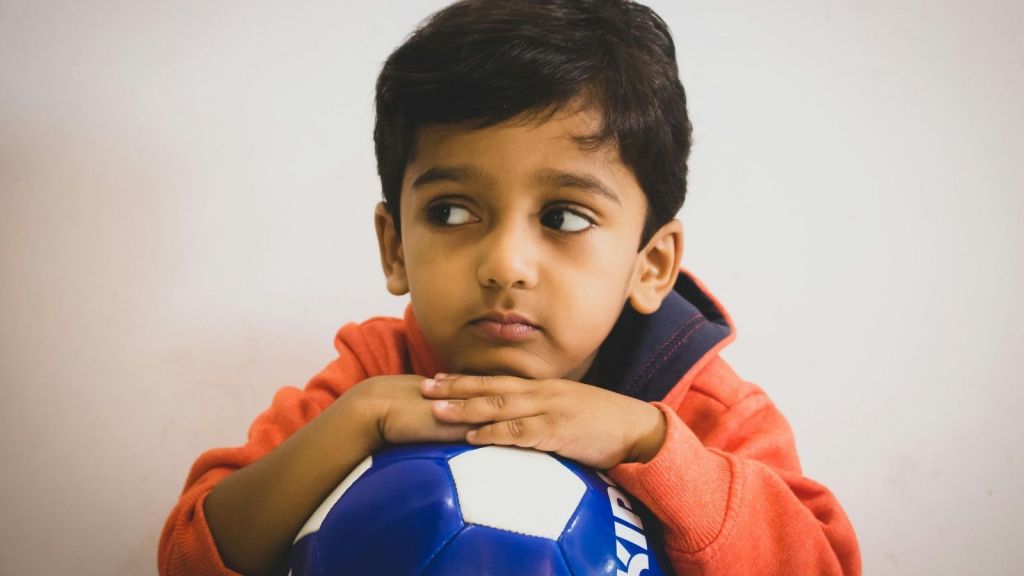 kid with soccer ball