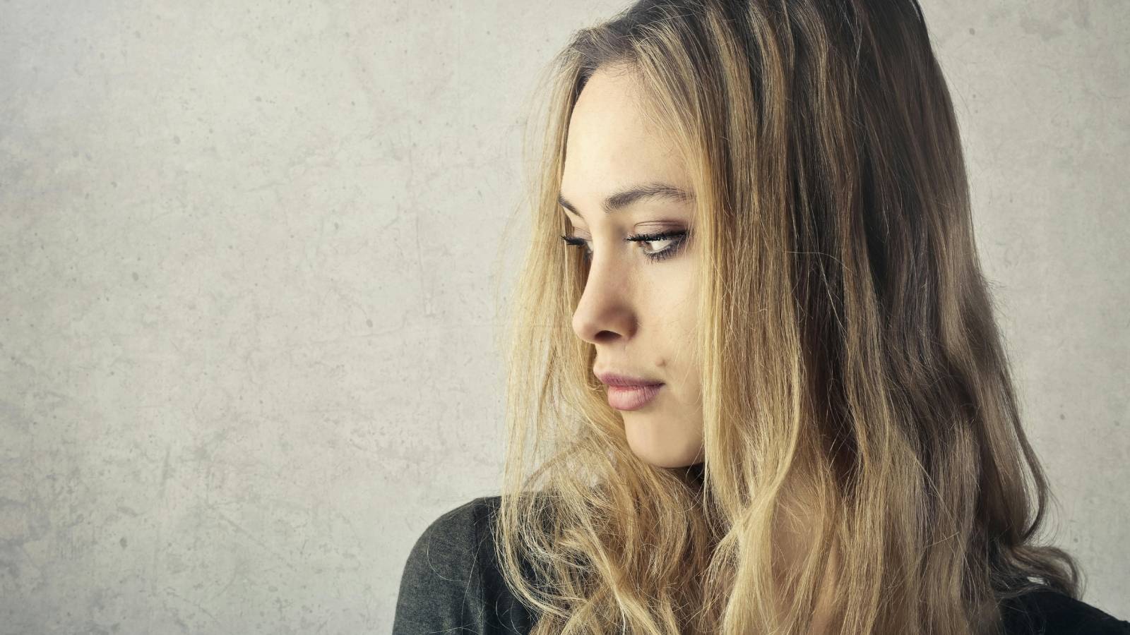 Woman thinking because her sister is upset with her
