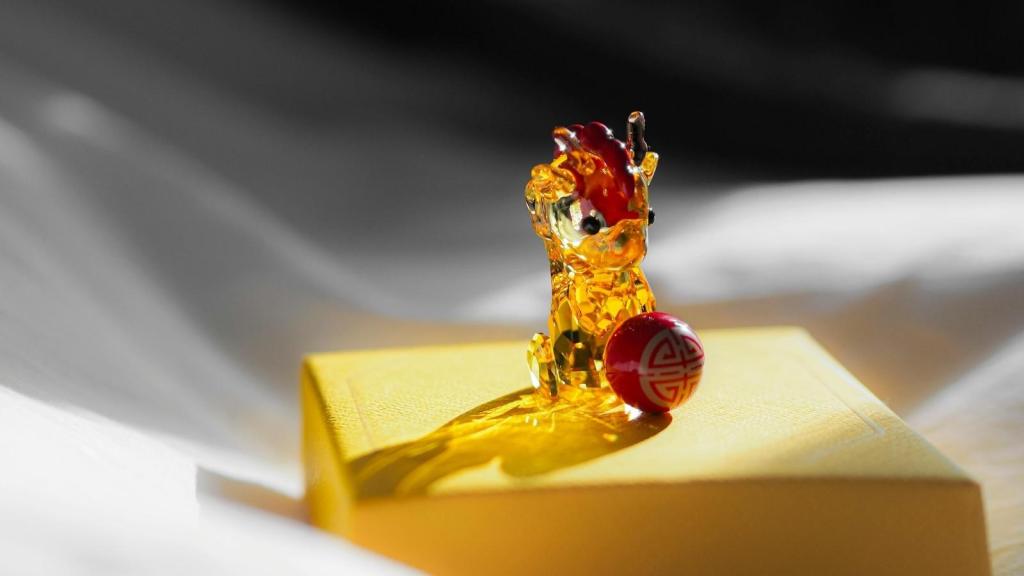 Pretty crystal figurine sitting on a gift box