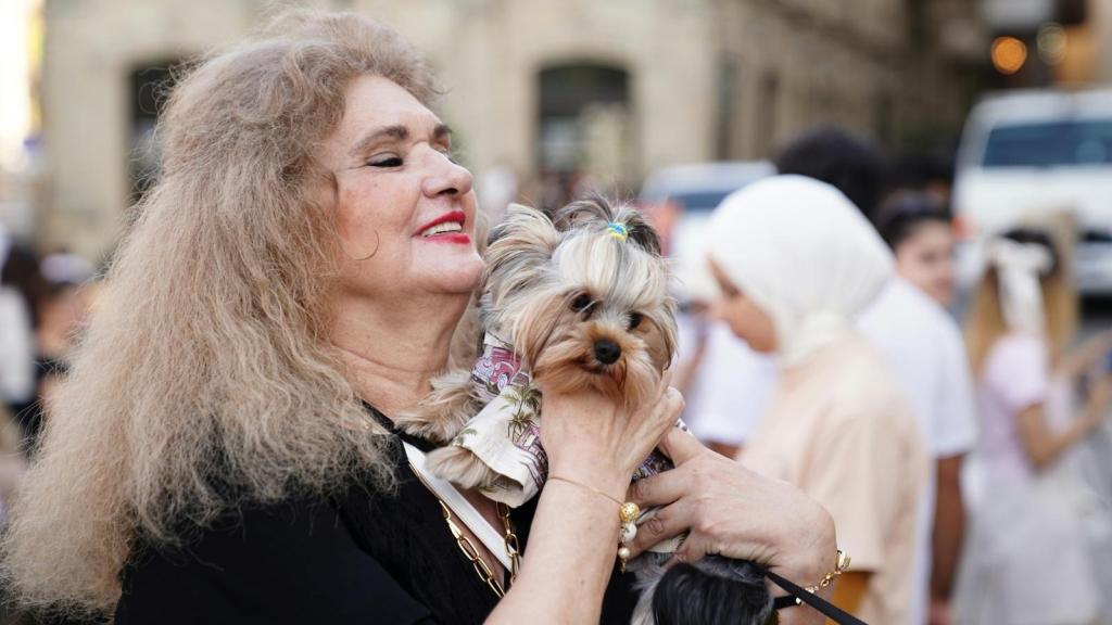 Woman holding her "service dog" in public