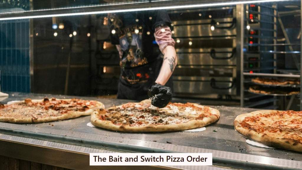 Pizza guy making pizzas behind glass