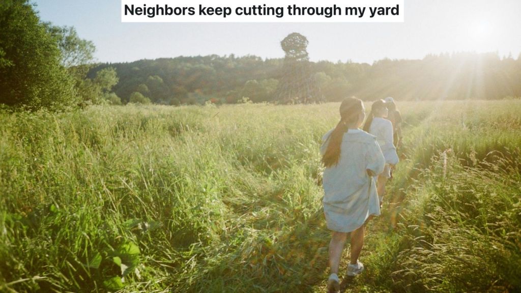 people walking through grass