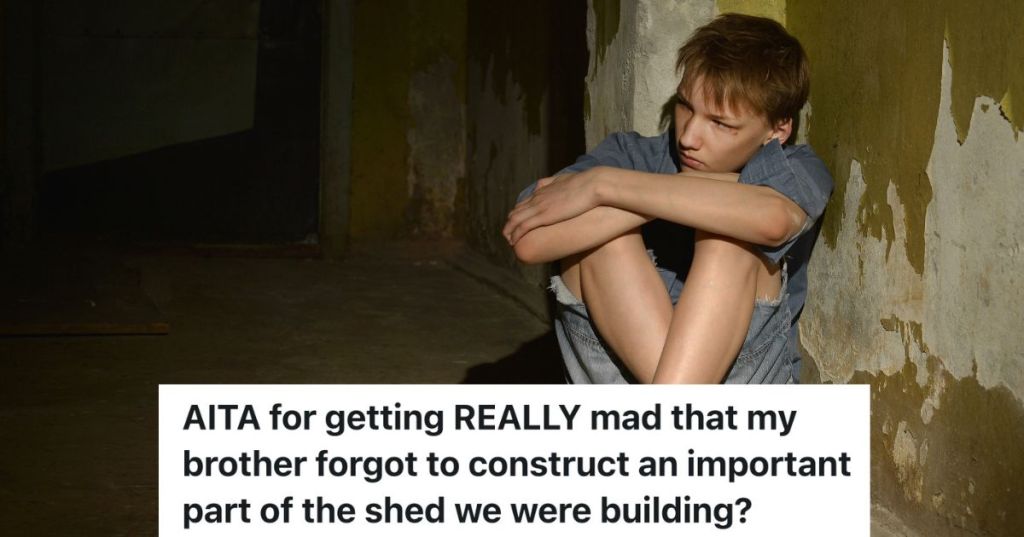 scared teenage boy sitting on the ground