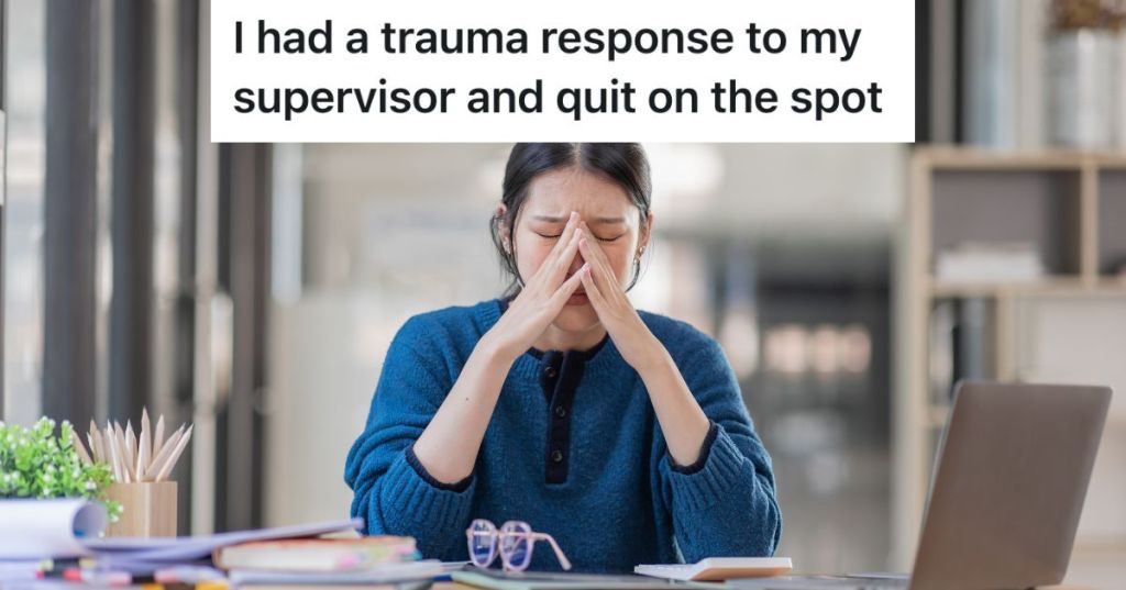 upset woman sitting at a desk