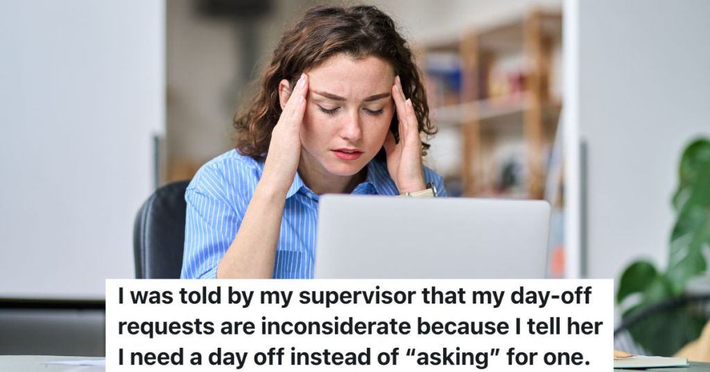 stressed out woman sitting at desk looking at her laptop