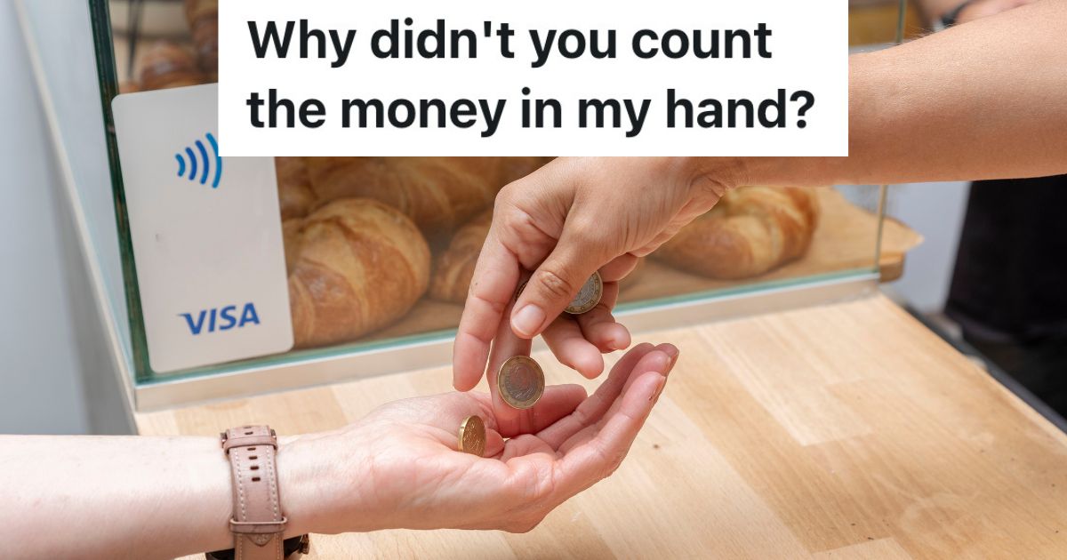 employee dropping coins in customer's hand