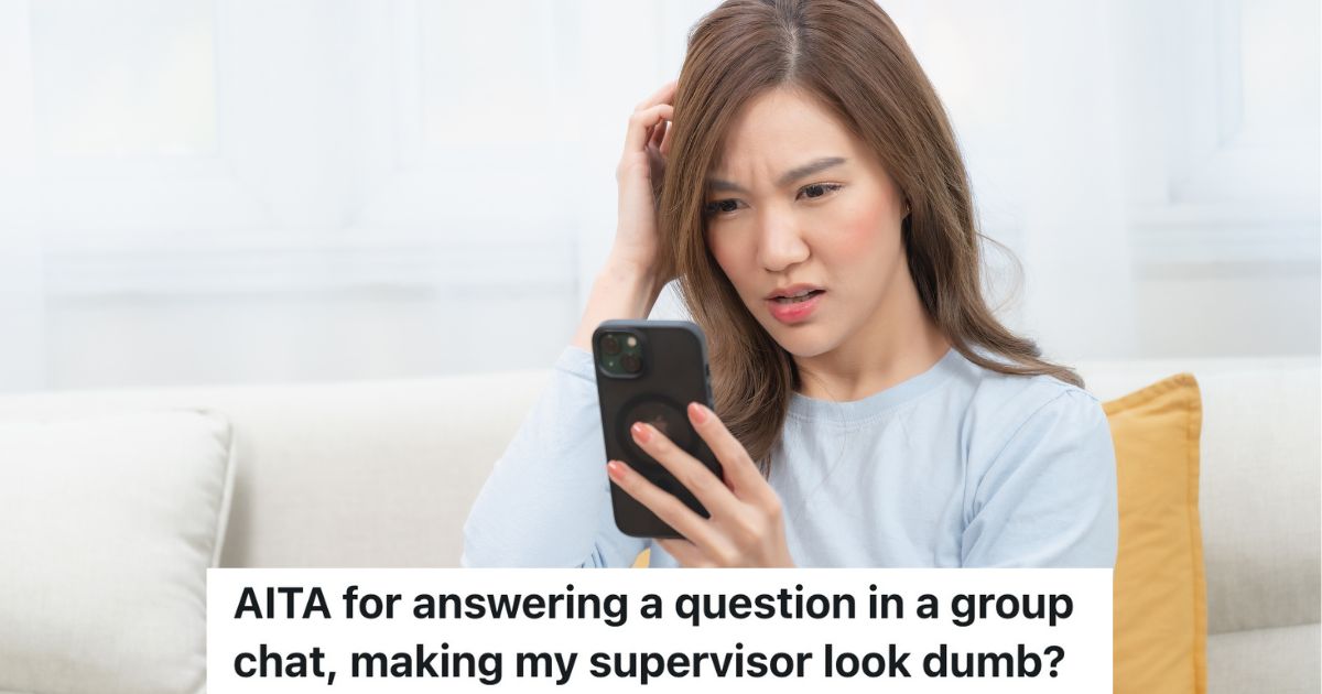 woman looking at her phone confused by what she sees