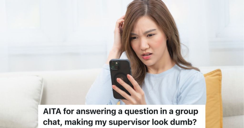 woman looking at her phone confused by what she sees