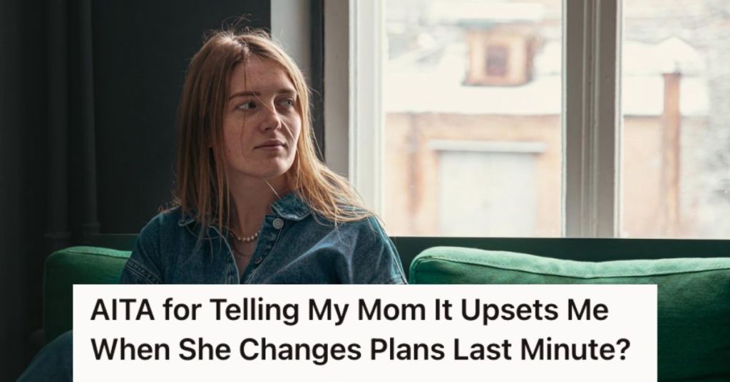 Woman feeling sad while sitting by thw window