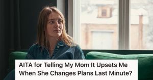 Woman feeling sad while sitting by the window