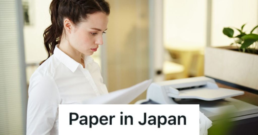 Woman looking at printed documents