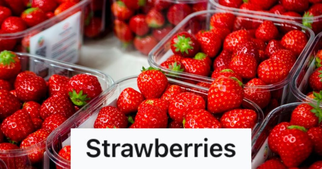 Red strawberries in clear plastic containers