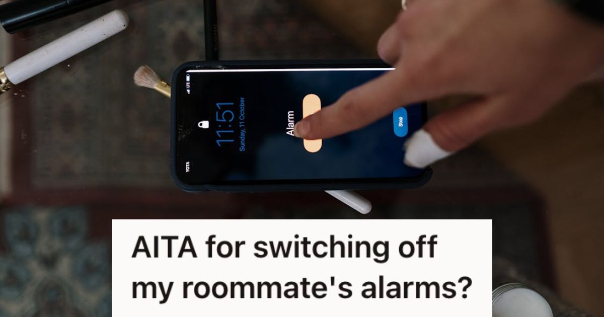 Person turning off the phone alarm