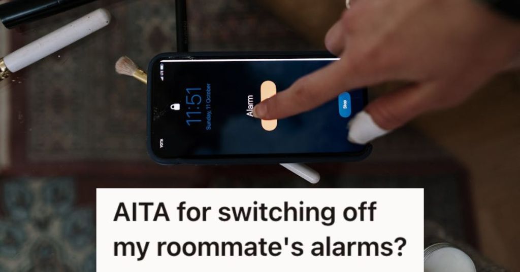Person turning off the phone alarm