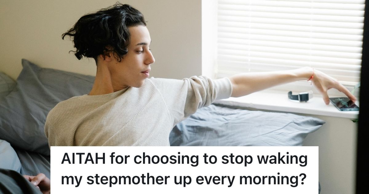 Teenage boy in bed, reaching for phone