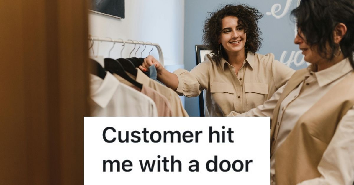 Two people browsing a rack of clothing