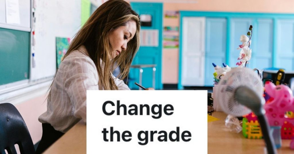 Female teacher at desk grading