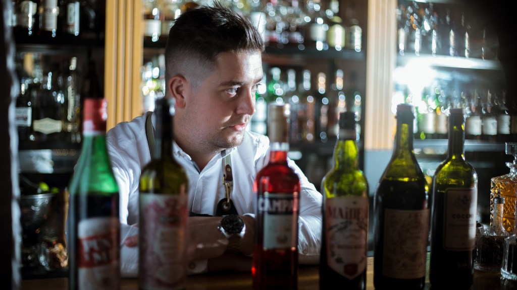 An upset looking bartender
