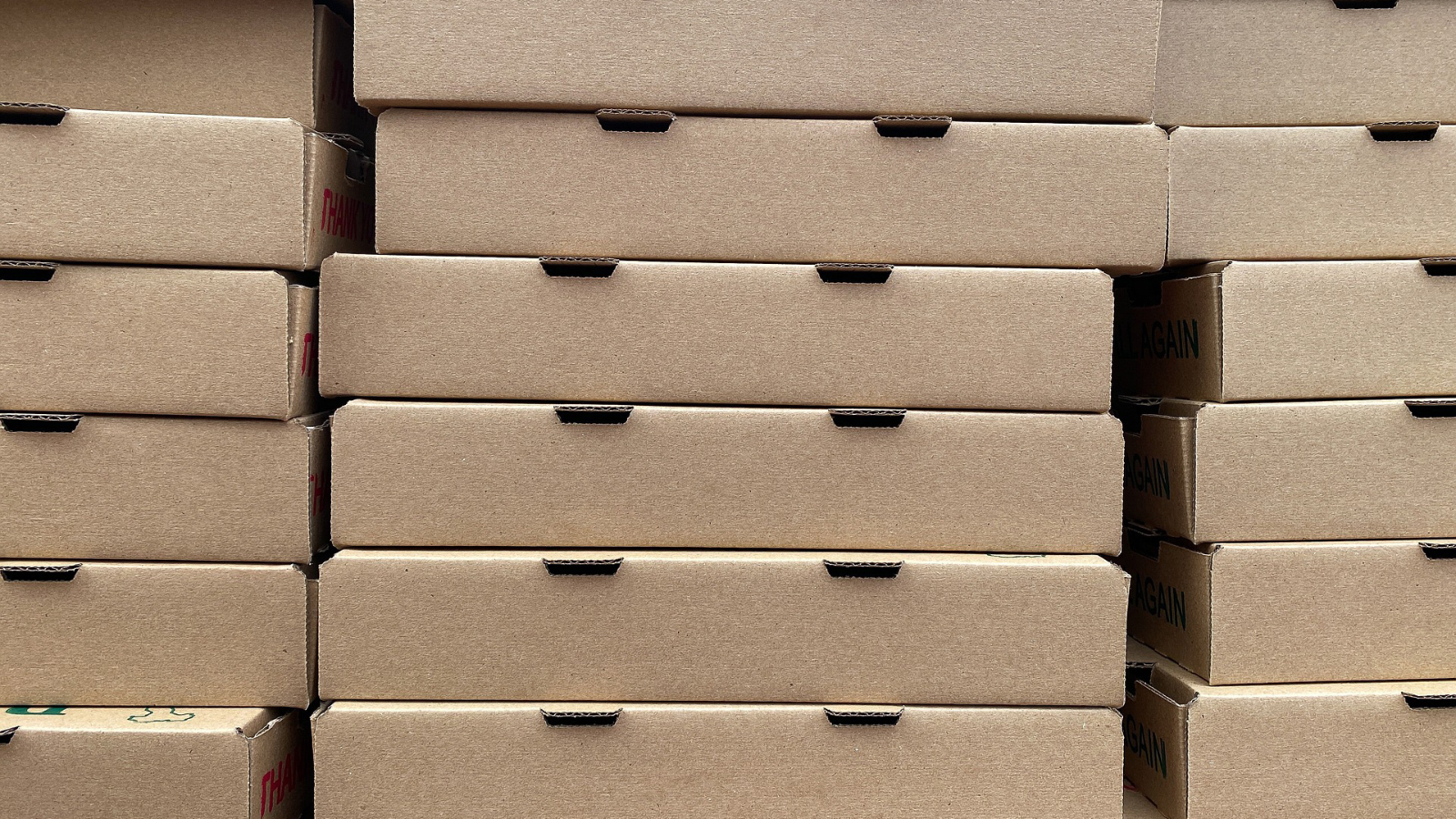 Stacks of pizza boxes