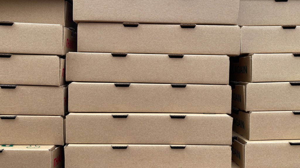 Stacks of pizza boxes