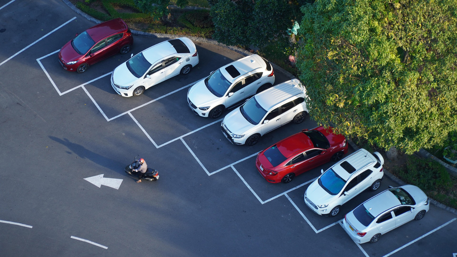 An overhead view of cars parked on a street