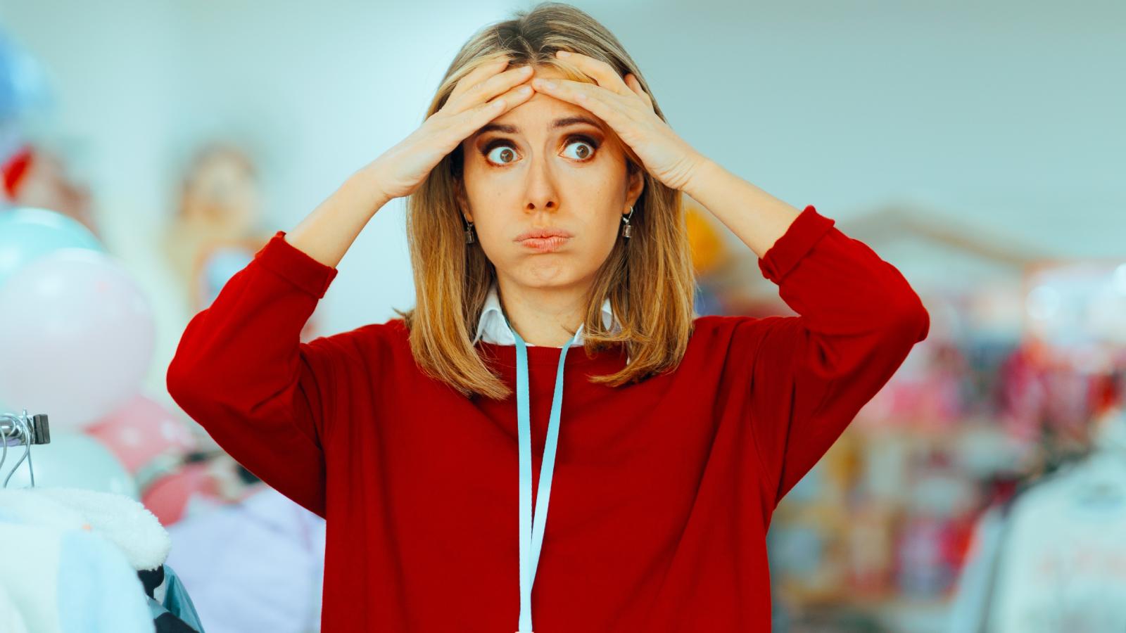 woman with her hands on her head