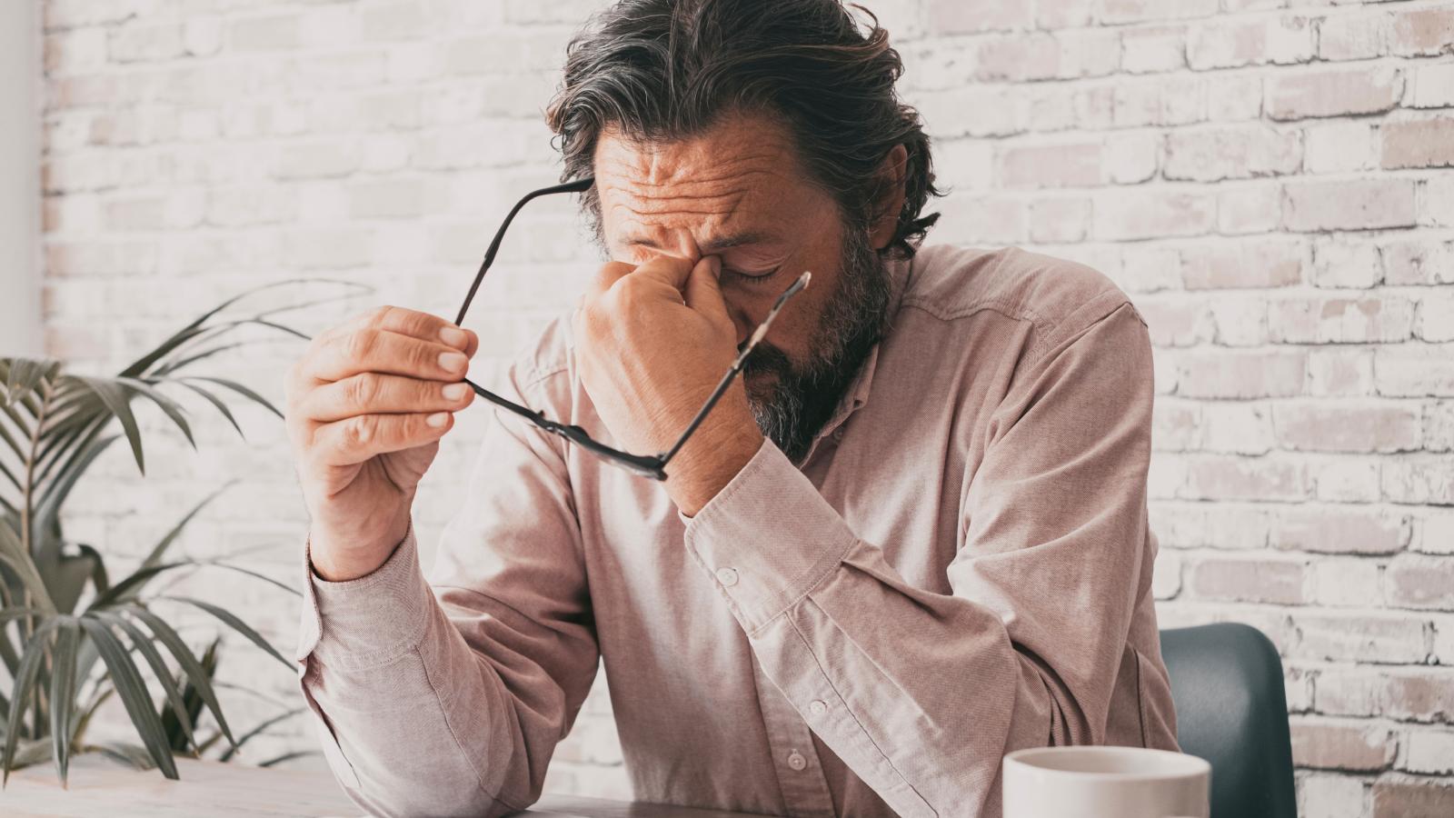 A Software Engineer’s Plan to Quit Turns Complicated After Seeing the Exit Requirements man stressed out at desk
