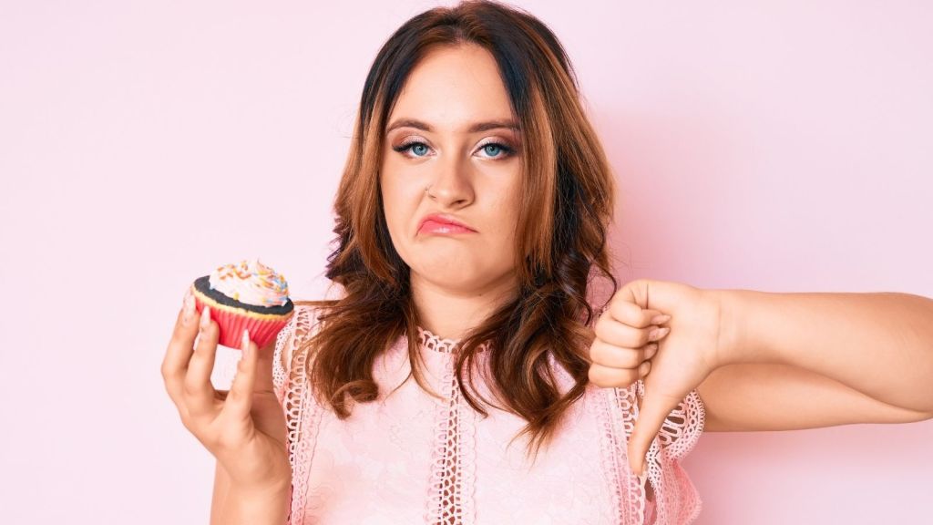 woman doesn't like her cupcake