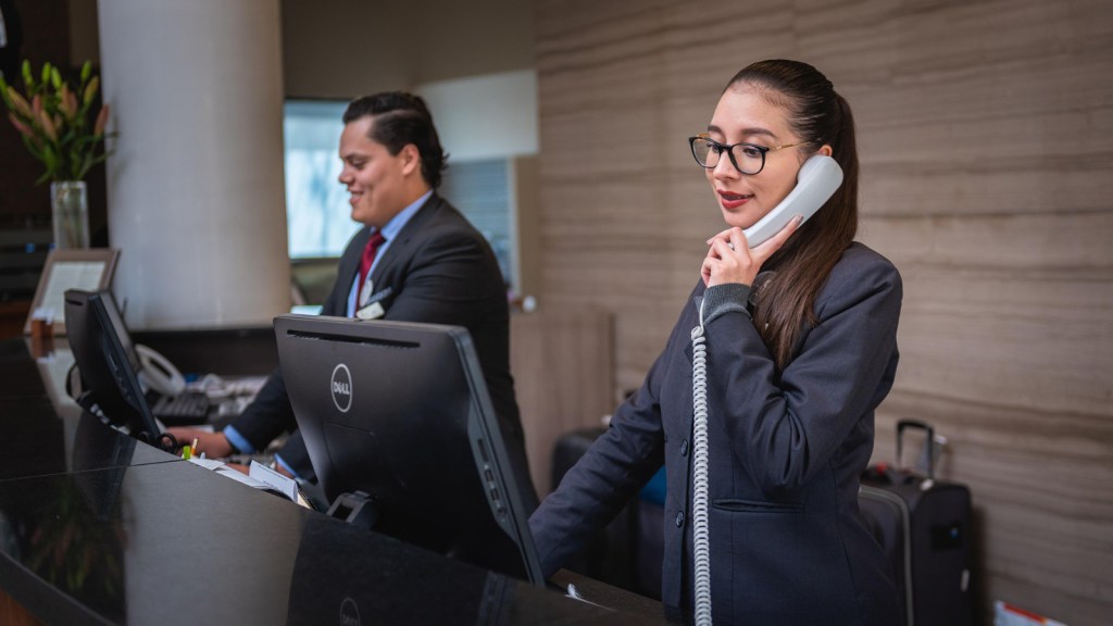 Employees at a hotel desk