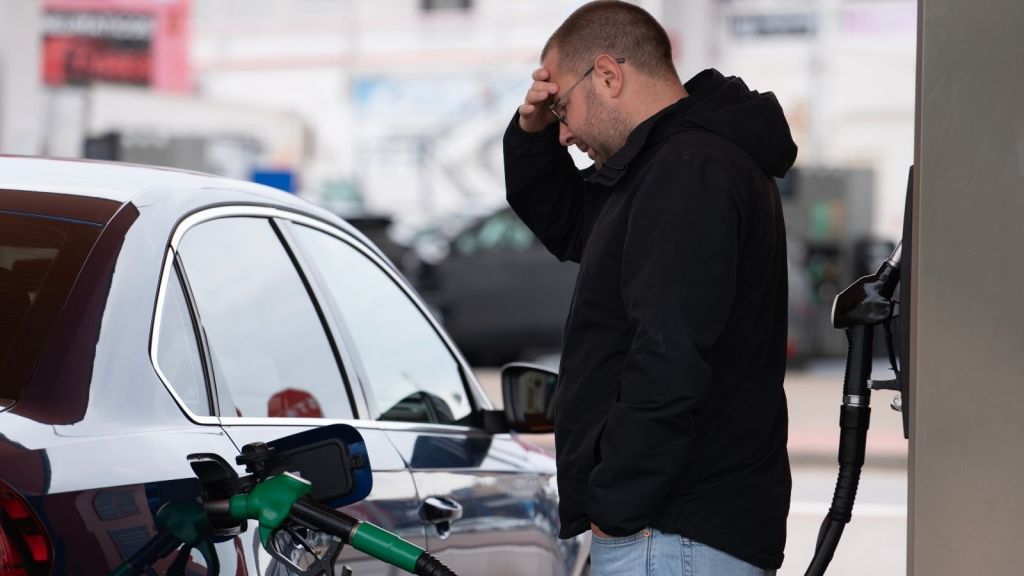 frustrated man at gas station