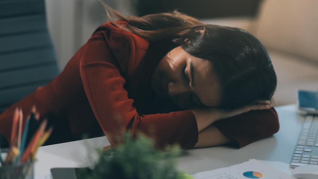 woman sleeping on desk