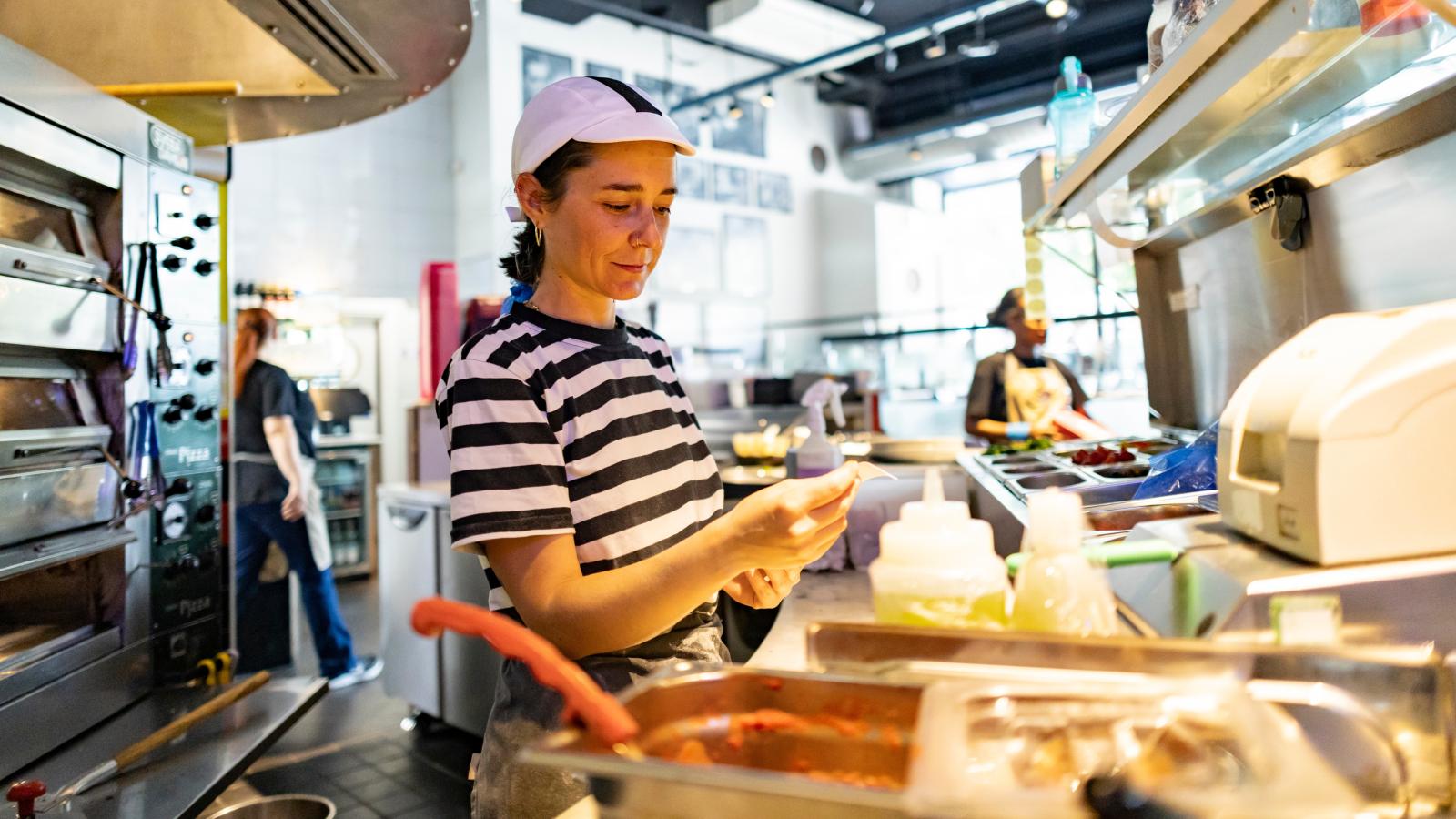 Boss Refuses to Promote Crucial Employee—Then Gets Fired After Realizing the Company Can’t Function Without Them fast food worker in kitchen