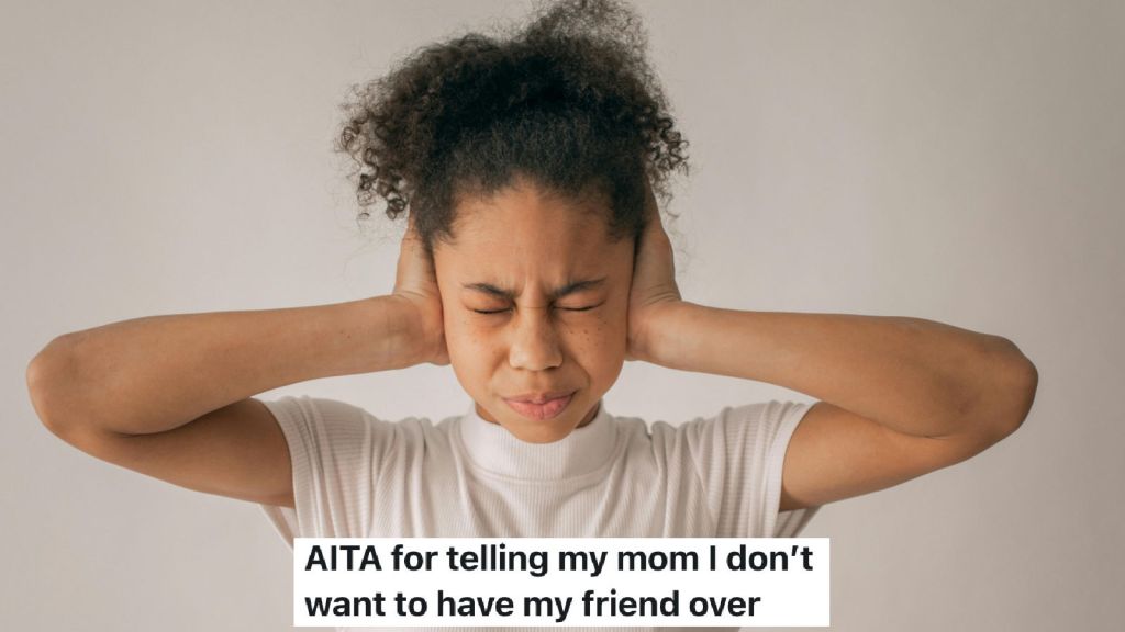 girl with her hands over her ears