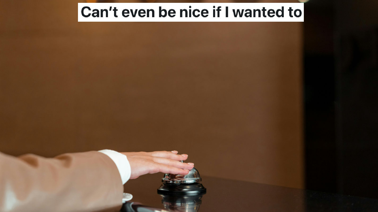 guest ringing a front desk bell