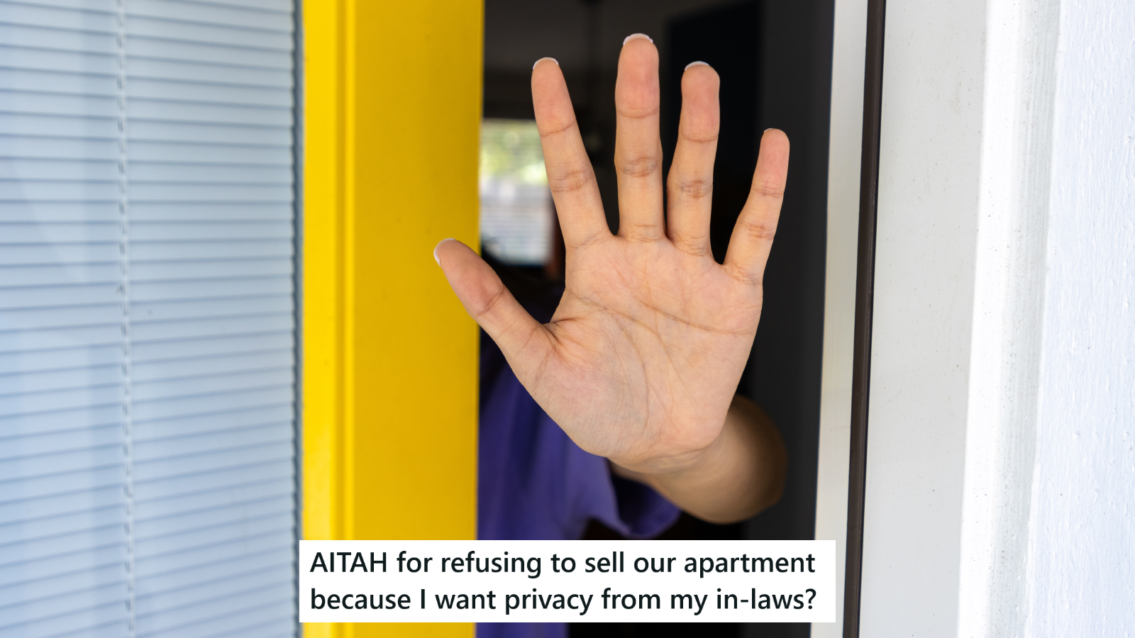 An upturned hand sticking out of a cracked open door