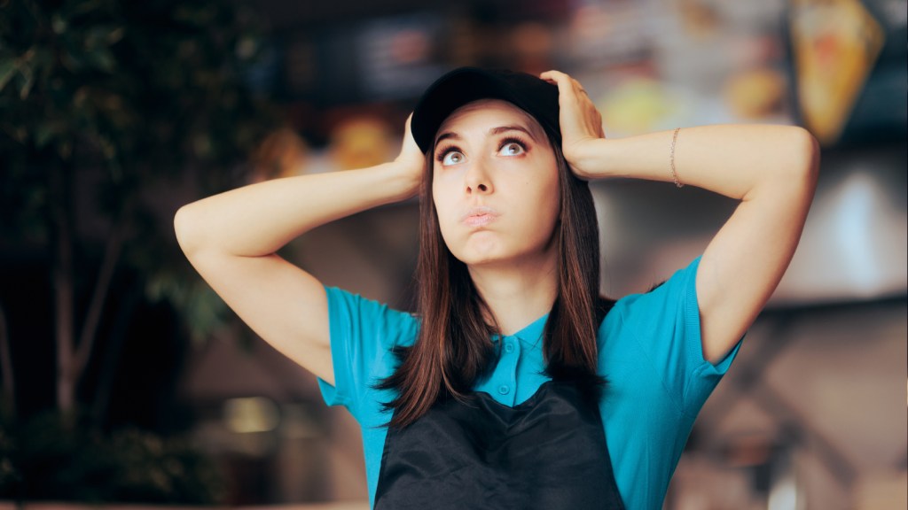 A retail working looking stressed