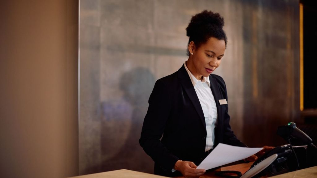 hotel front desk employee female