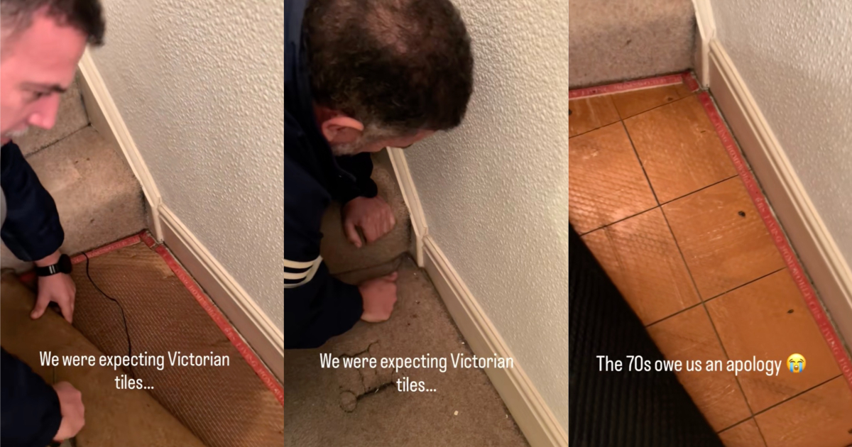 man pulling up carpet