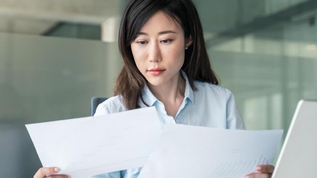 woman looking at reports