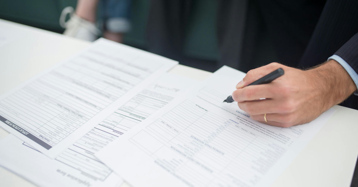 man filling out a job application