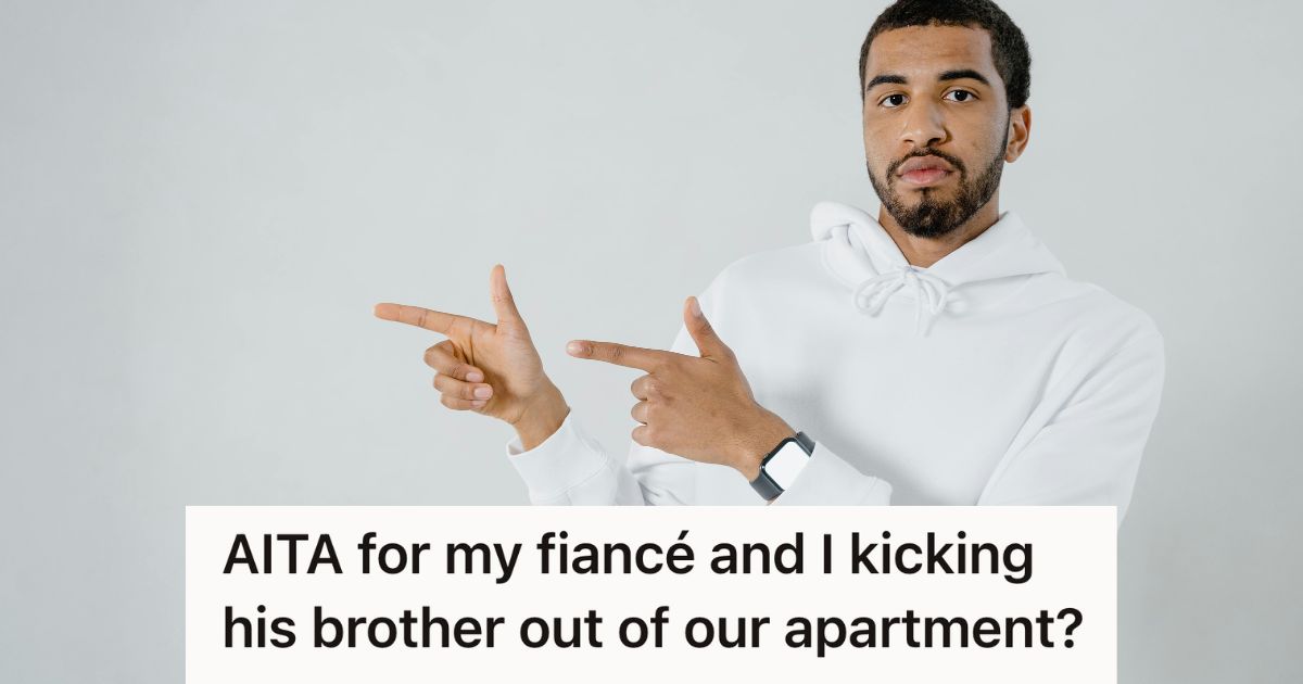 Couple Gave A Freeloading Sibling Every Chance To Pay His Share, But When He Chose Vacation Plans Over Contributing To Rent, They Finally Kicked Him Out man in white hoodie pointing
