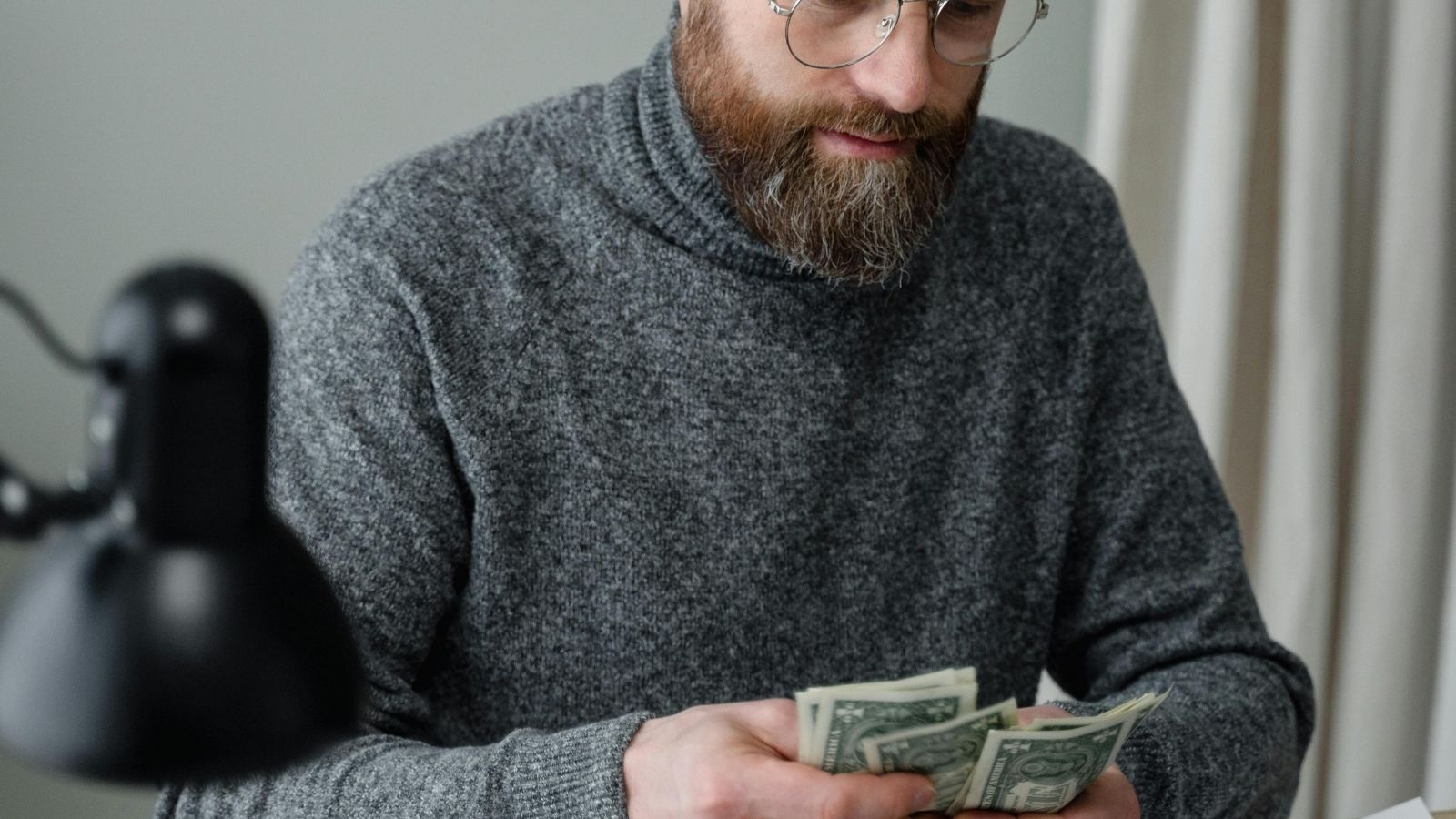 man counting cash
