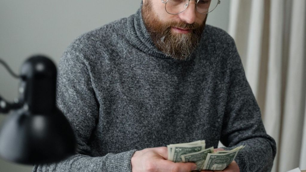 man counting cash