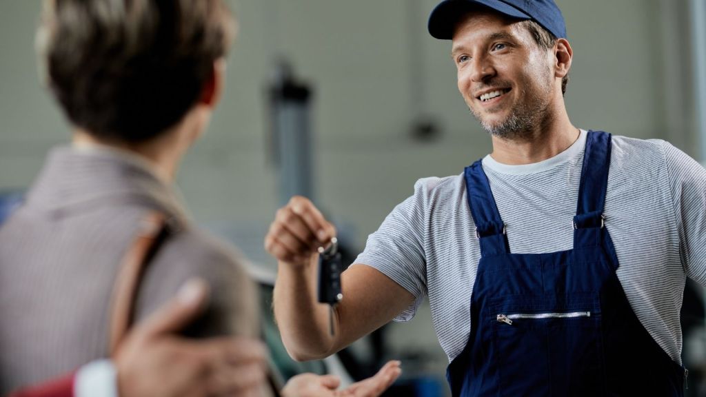 mechanic handing back keys