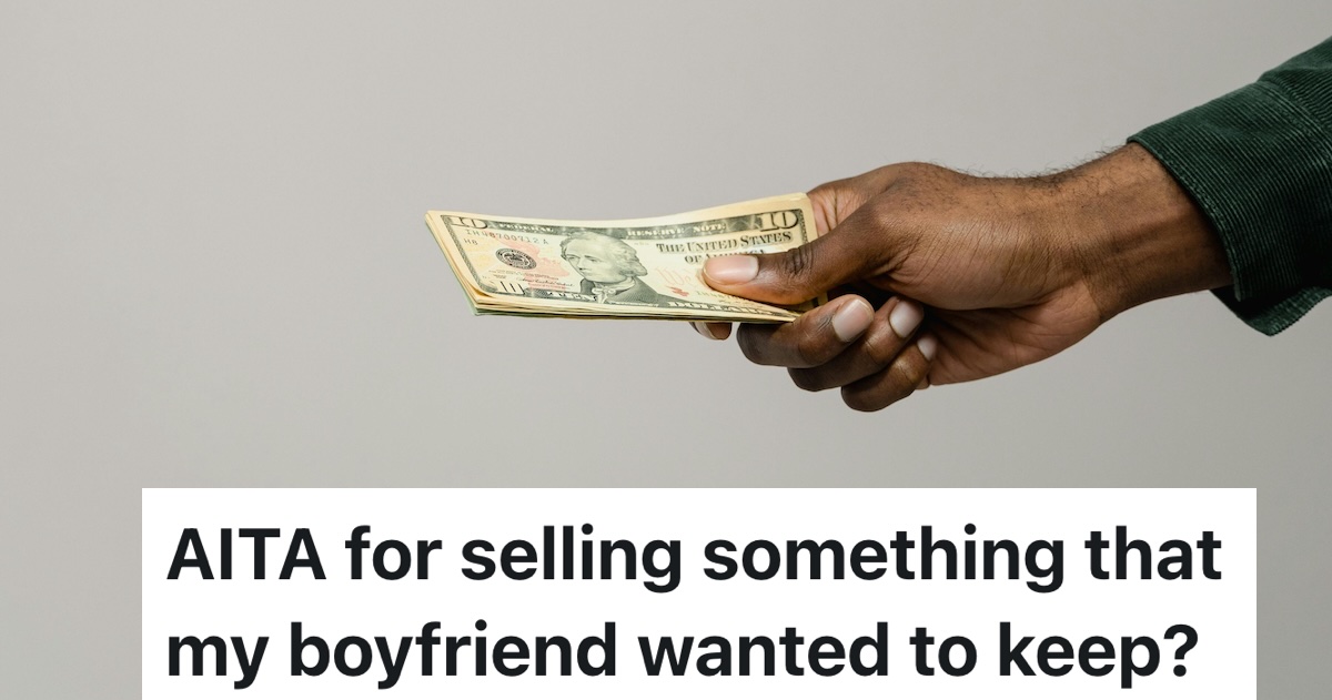 person handing over dollar bills/money