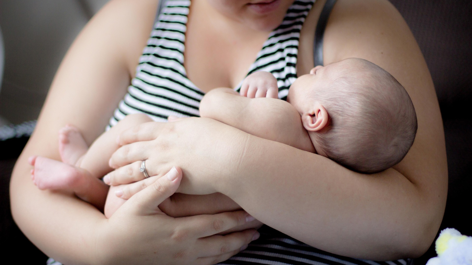 A mother holding her baby