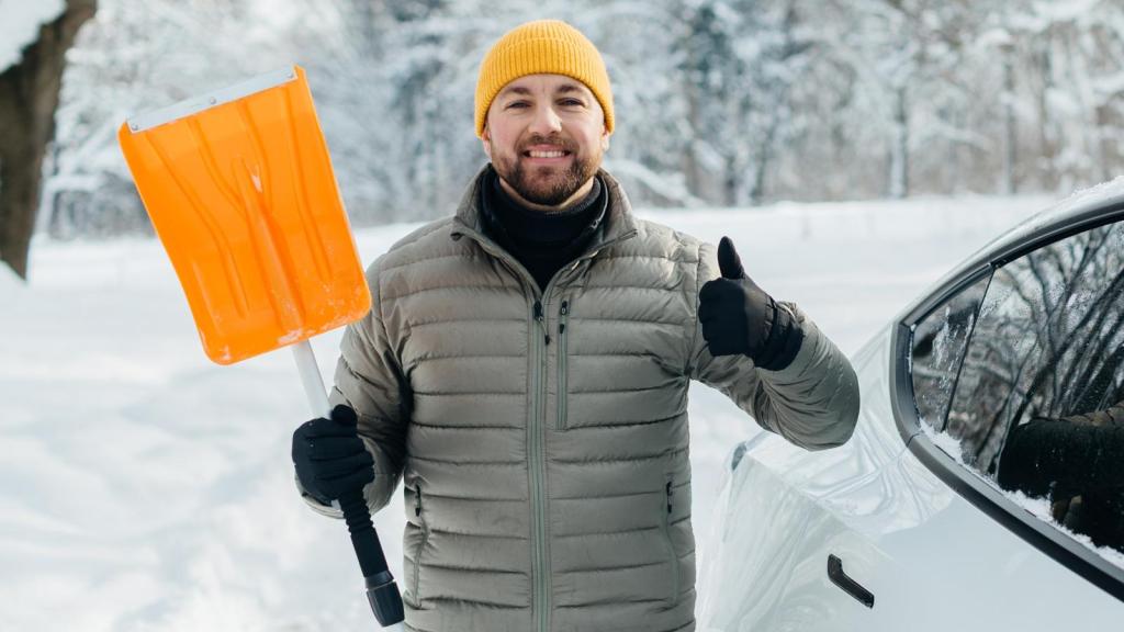 man holding a snow shovel